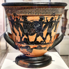 Attic_black-figure_calyx_krater_with_a_Homeric_battle_(6th_cent._B.C.)_at_the_National_Archaeological_Museum_of_Athens_on_4_June_2018.jpg