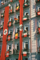 NSDAP and Italian flags draped from balconies to welcome Adolf Hitler during state visit to Italy [1938].jpg