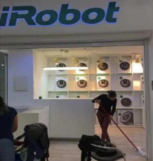 irobot-store-human-sweeping.jpeg