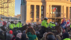 Disclose.tv - NOW - Canada - Chaotic scenes in #Ottawa in front of the senate building. Police ride on horses into the crowd of protesters. [1494805011070652422].mp4