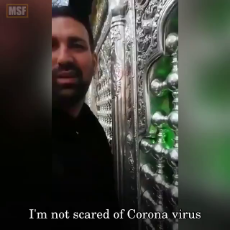 While the city of Qom is the epicentre of CoronaVirus in Iran, authorities refuse to close down religious shrines there. These pro-regime people are licking the shrines & encouraging people to visit them.mp4