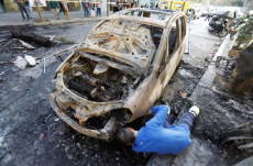 a-worker-removes-a-burned-car-after-clashes-of-separatist-demonstrators-after-a-verdict-in-a-trial-over-a-banned-independence-referendum-in-barcelona-spain-october-17-2019-reuters-jon-nazca.jpg