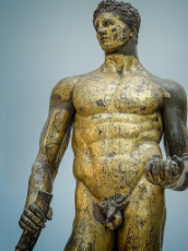 Gilded_Bronze_statue_of_a_beardless_Hercules_cast_in_the_Greek_Lysippic_style_of_the_4th_century_BCE_found_in_the_remains_of_the_Forum_Boarium_Capitoline_Museum.jpg