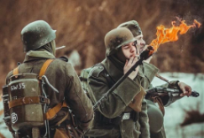 German WWII Soldier Lighting Cigarette with Flamethrower.jpg
