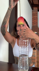 Woman Practices Magic Trick with an Apple and a Bottle.mp4