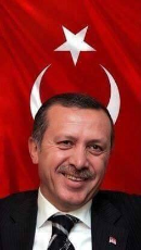 erdogan-turk-flag-devil-horns.jpg