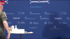 denmark gov official collapses during vaccine press conference.mp4