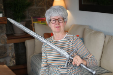 senior-geek-holding-sword-home-senior-geek-holding-sword-home-199595279-4208689842.jpg