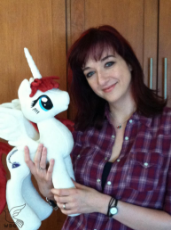 lauren_faust_with_the_fausticorn_i_made_for_her_by_whitedove_creations-d5cu8pn.jpg
