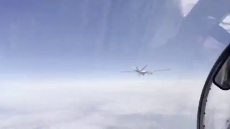 First Footage Of Russian Su-27 Harassing American MQ-9 Reaper.mp4